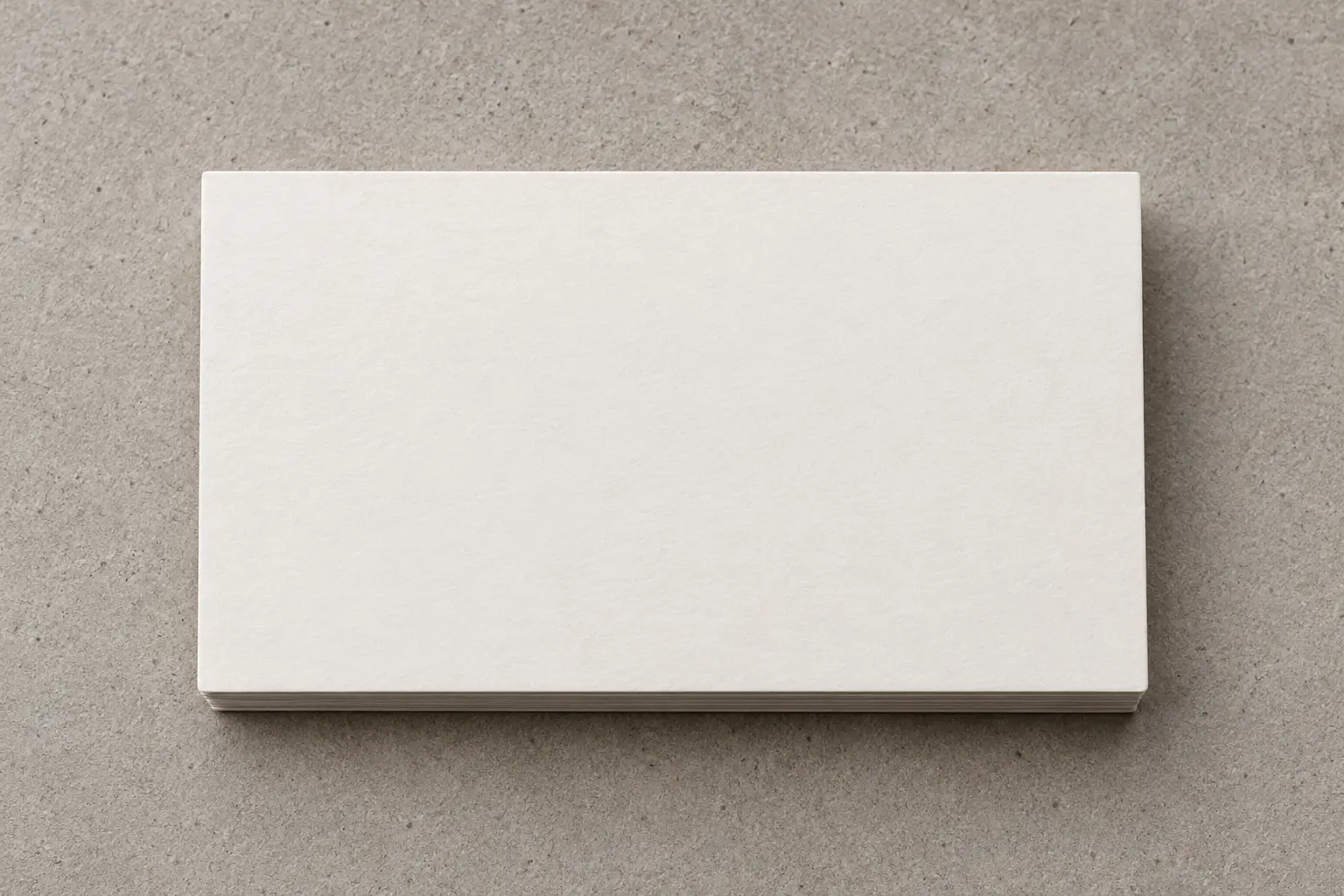 Matte soft-touch business card on textured stone