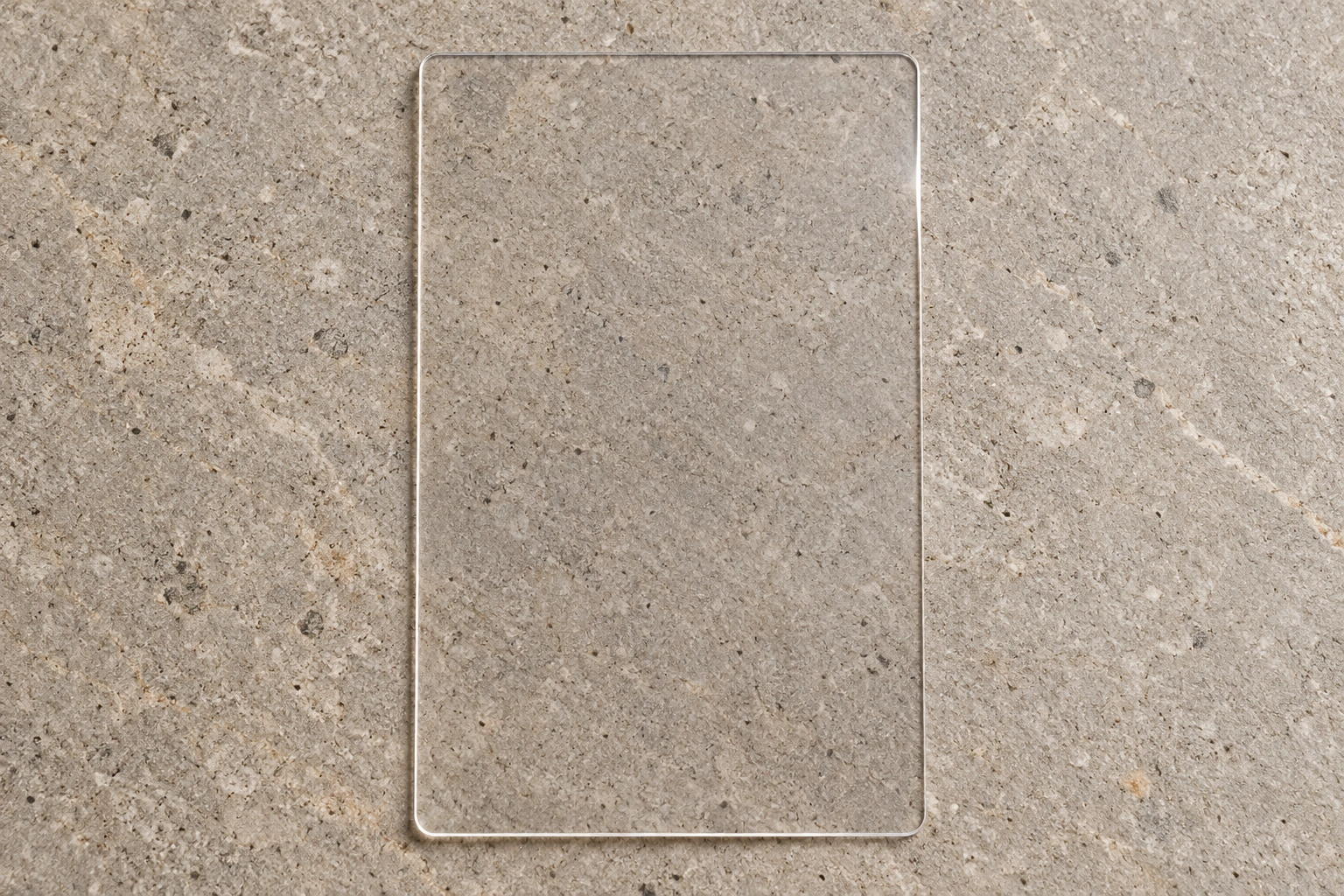 Clear plastic voucher photographed on textured stone